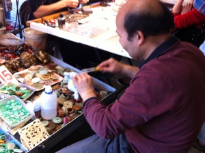 Man polishing piece of jade